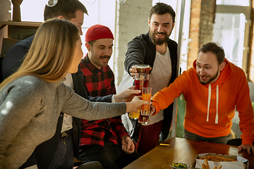 Image showing Happy co-workers celebrating while company party and corporate event