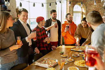 Image showing Happy co-workers celebrating while company party and corporate event