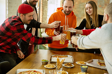 Image showing Happy co-workers celebrating while company party and corporate event