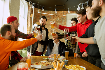 Image showing Happy co-workers celebrating while company party and corporate event