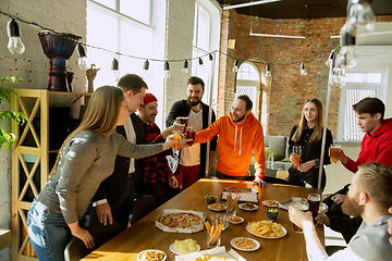 Image showing Happy co-workers celebrating while company party and corporate event