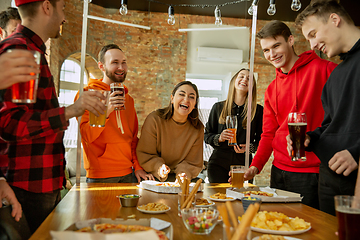 Image showing Happy co-workers celebrating while company party and corporate event