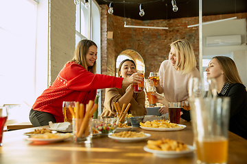 Image showing Happy co-workers celebrating while company party and corporate event