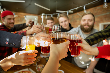 Image showing Happy co-workers celebrating while company party and corporate event