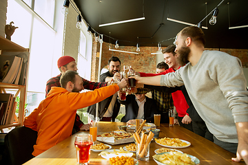 Image showing Happy co-workers celebrating while company party and corporate event