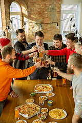 Image showing Happy co-workers celebrating while company party and corporate event