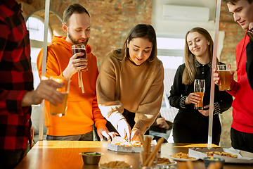 Image showing Happy co-workers celebrating while company party and corporate event