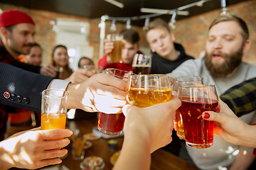 Image showing Happy co-workers celebrating while company party and corporate event