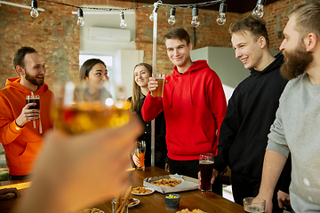 Image showing Happy co-workers celebrating while company party and corporate event