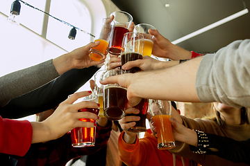 Image showing Happy co-workers celebrating while company party and corporate event