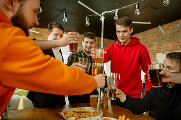 Image showing Happy co-workers celebrating while company party and corporate event