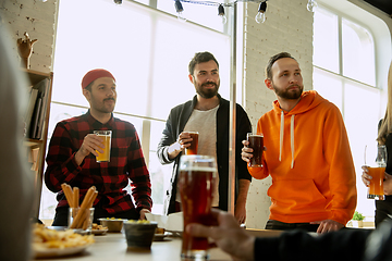 Image showing Happy co-workers celebrating while company party and corporate event