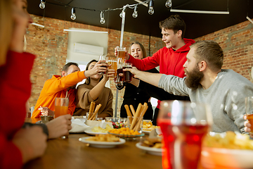 Image showing Happy co-workers celebrating while company party and corporate event