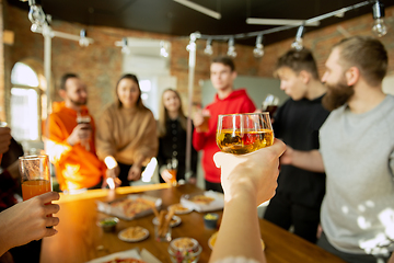 Image showing Happy co-workers celebrating while company party and corporate event