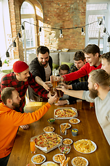 Image showing Happy co-workers celebrating while company party and corporate event