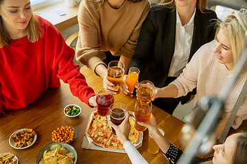 Image showing Happy co-workers celebrating while company party and corporate event