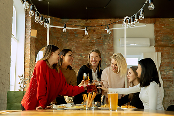 Image showing Happy co-workers celebrating while company party and corporate event