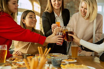 Image showing Happy co-workers celebrating while company party and corporate event