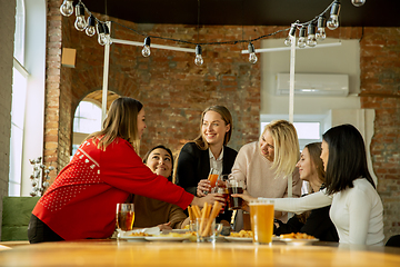 Image showing Happy co-workers celebrating while company party and corporate event