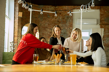 Image showing Happy co-workers celebrating while company party and corporate event