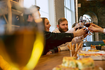 Image showing Happy co-workers celebrating while company party and corporate event