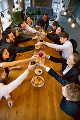 Image showing Happy co-workers celebrating while company party and corporate event