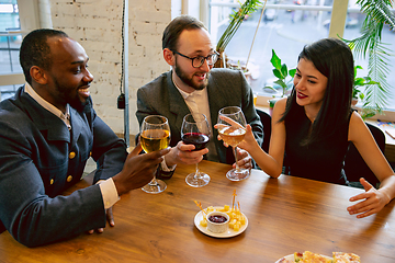 Image showing Happy co-workers celebrating while company party and corporate event