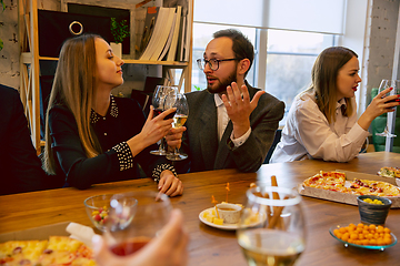 Image showing Happy co-workers celebrating while company party and corporate event