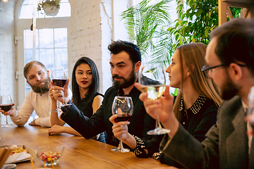 Image showing Happy co-workers celebrating while company party and corporate event