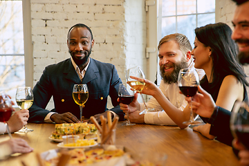 Image showing Happy co-workers celebrating while company party and corporate event