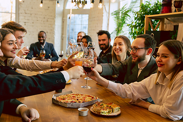 Image showing Happy co-workers celebrating while company party and corporate event