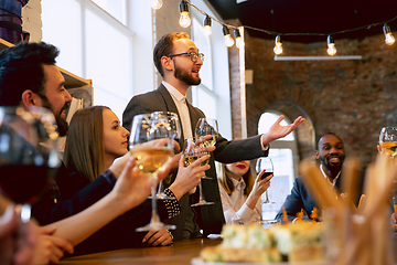 Image showing Happy co-workers celebrating while company party and corporate event