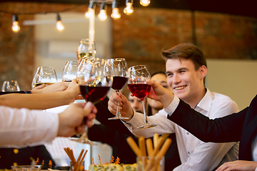 Image showing Happy co-workers celebrating while company party and corporate event