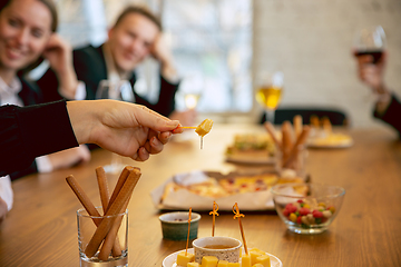 Image showing Happy co-workers celebrating while company party and corporate event