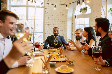 Image showing Happy co-workers celebrating while company party and corporate event