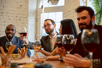 Image showing Happy co-workers celebrating while company party and corporate event