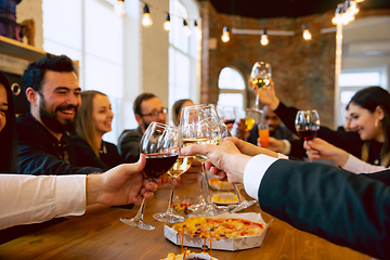 Image showing Happy co-workers celebrating while company party and corporate event