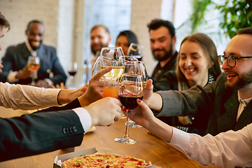 Image showing Happy co-workers celebrating while company party and corporate event