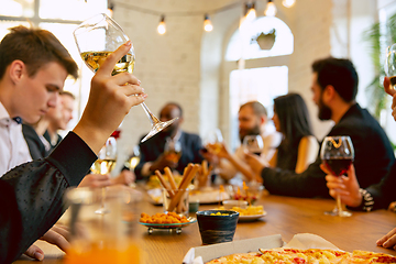 Image showing Happy co-workers celebrating while company party and corporate event