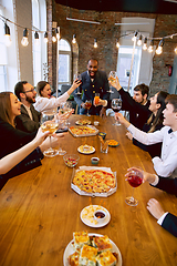 Image showing Happy co-workers celebrating while company party and corporate event