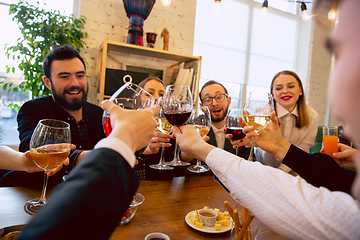 Image showing Happy co-workers celebrating while company party and corporate event