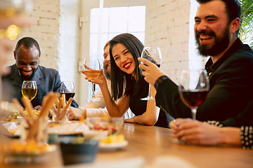 Image showing Happy co-workers celebrating while company party and corporate event