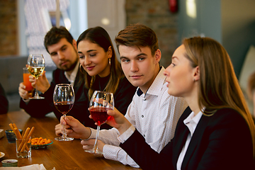 Image showing Happy co-workers celebrating while company party and corporate event