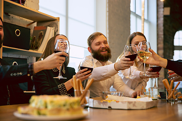 Image showing Happy co-workers celebrating while company party and corporate event