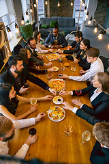 Image showing Happy co-workers celebrating while company party and corporate event