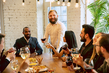 Image showing Happy co-workers celebrating while company party and corporate event