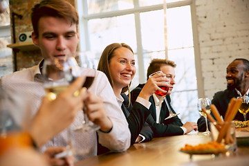 Image showing Happy co-workers celebrating while company party and corporate event