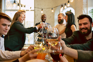 Image showing Happy co-workers celebrating while company party and corporate event