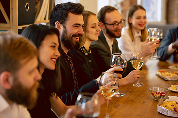 Image showing Happy co-workers celebrating while company party and corporate event