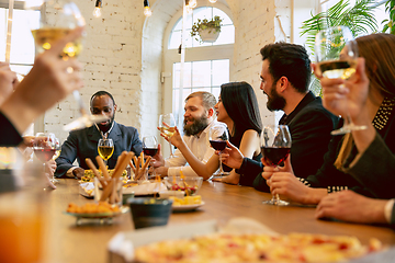 Image showing Happy co-workers celebrating while company party and corporate event